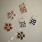 Mushie Pukkasztós játék - Telefon (Púderrózsaszín)